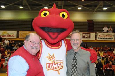 Vice Provost Curt Coonrod_ the new mascot and Chancellor George at the unveiling of the mascot at a basketball game_.jpg